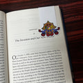 Open book with a colorful bookmark on a wooden surface